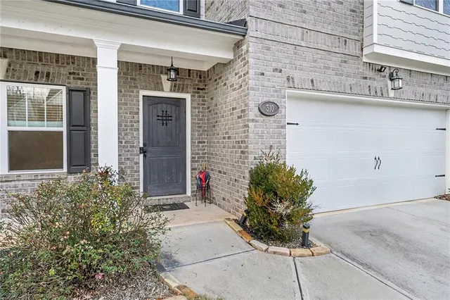 a potted plant sitting in front of a house