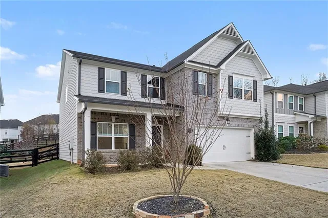 a front view of a house with a yard