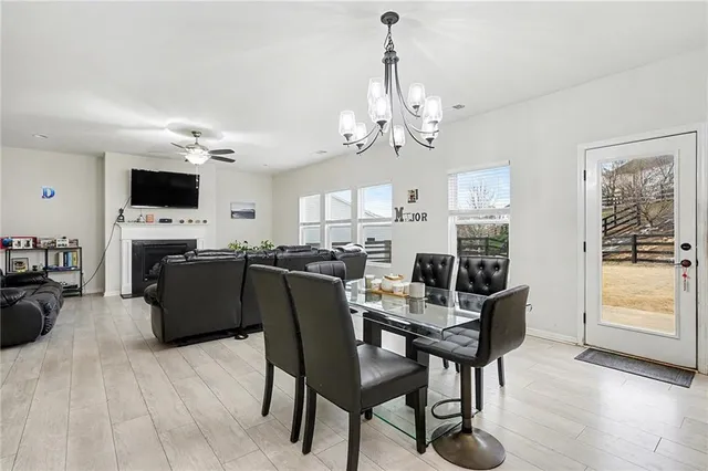 a view of a livingroom with furniture and a flat screen tv
