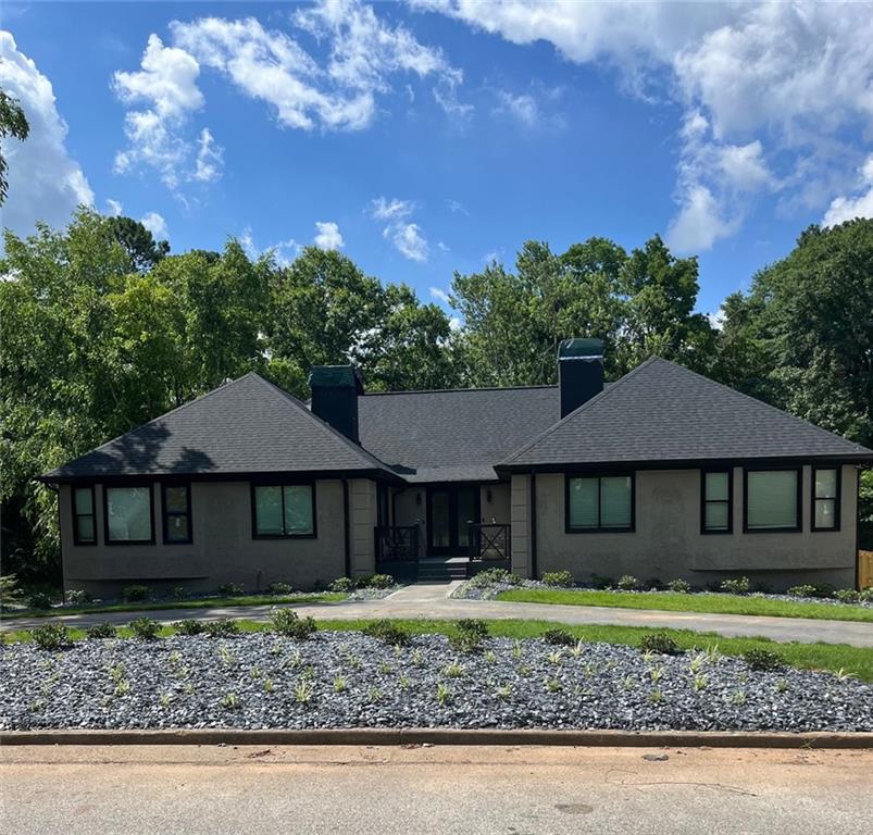 2137 Fieldstone View Court Southeast, Unit B Conyers, GA 30013 - Photo 1 of 1 a front view of a house with garden