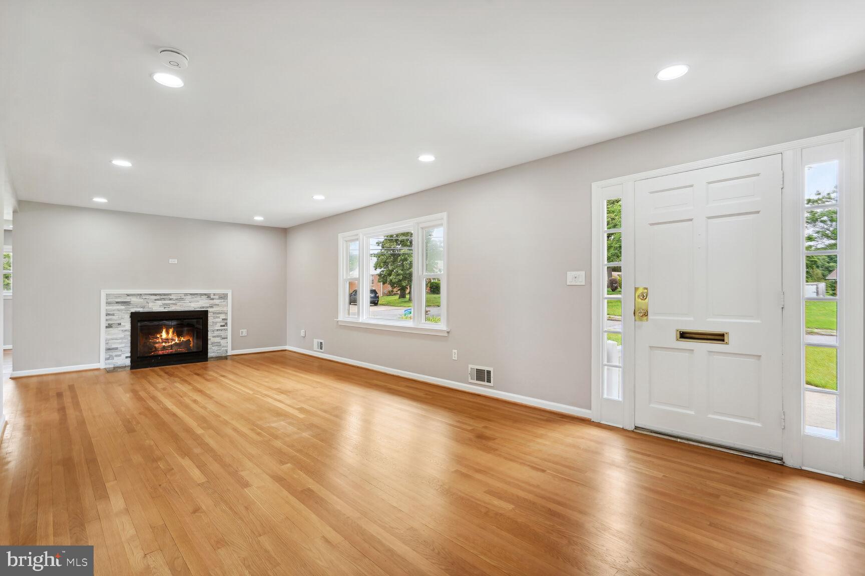 8420 Rambler Drive Adelphi, MD 20783 - Photo 6 of 29 Living Room with Beautiful Hardwood & Fireplace