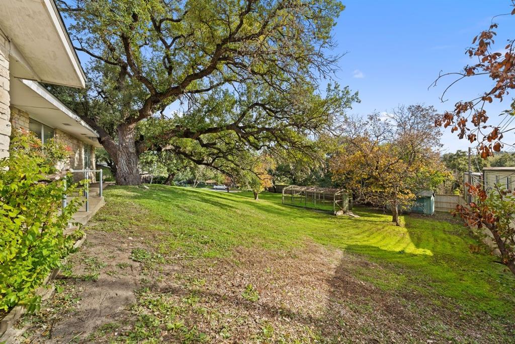 601 Sandringham Circle Austin, TX 78704 - Photo 3 of 40 a view of a yard with swimming pool