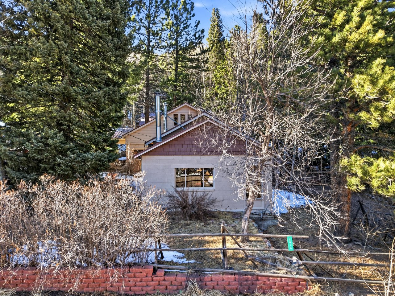 2476 Riverside Drive Lyons, CO 80540 - Photo 1 of 42 a sign on the side of a road
