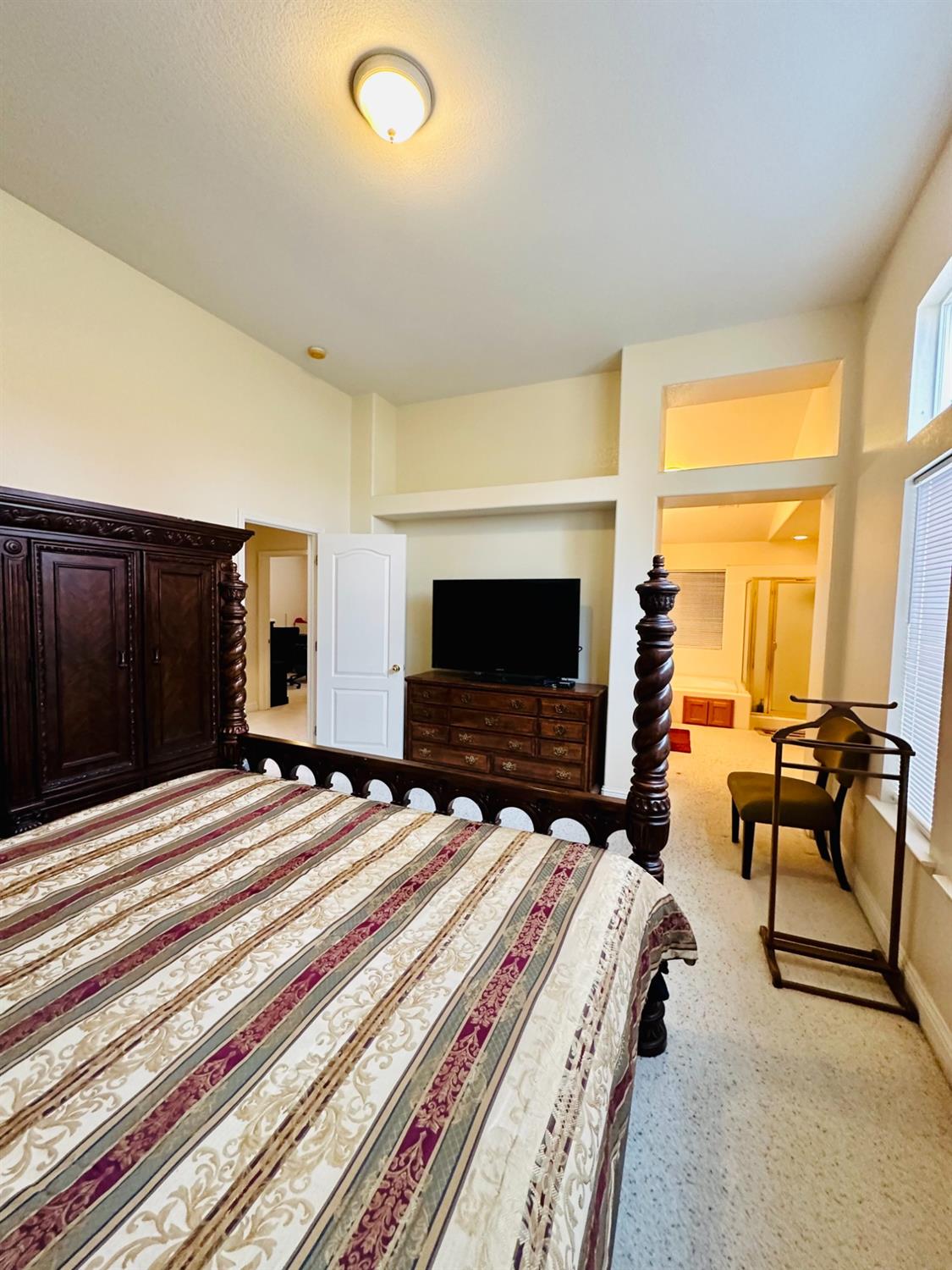 2439 Prescott Avenue Clovis, CA 93619 - Photo 15 of 25 a bedroom with a bed and a flat screen tv