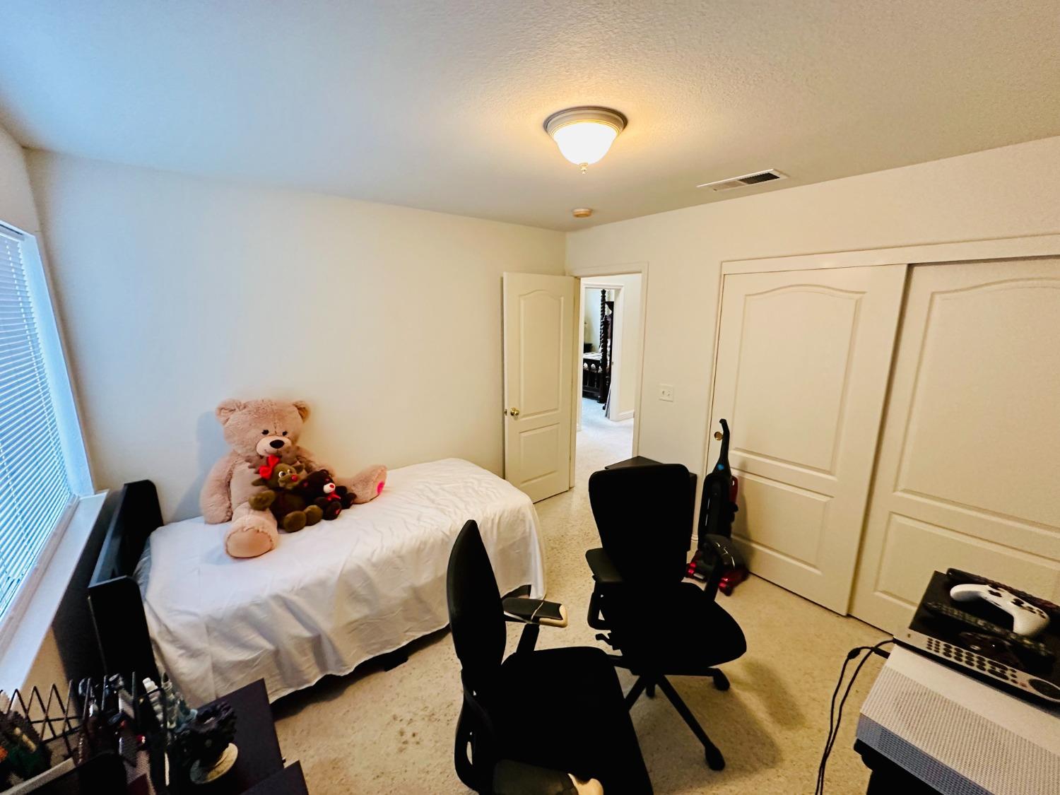 2439 Prescott Avenue Clovis, CA 93619 - Photo 20 of 25 a living room with furniture and a flat screen tv