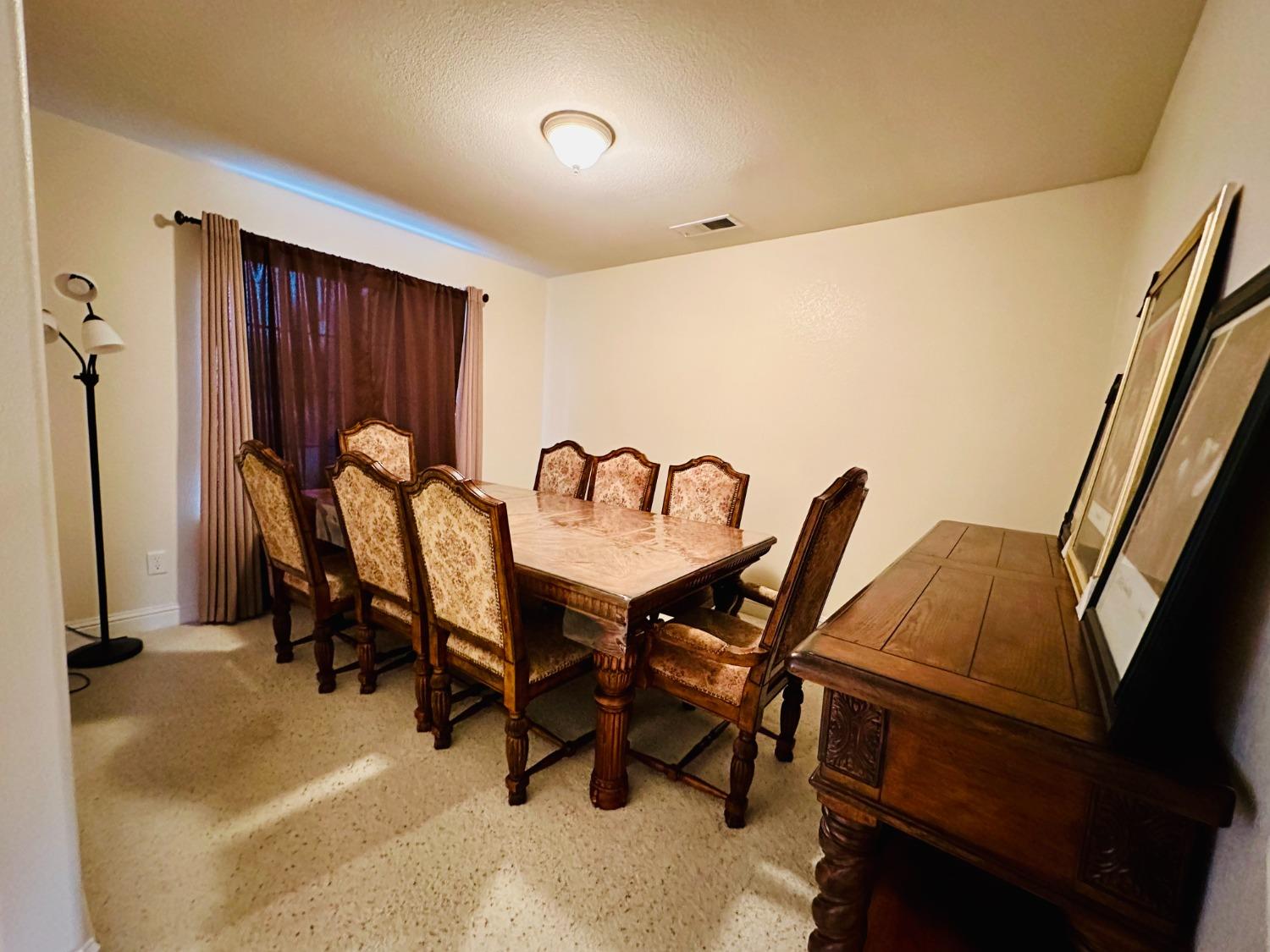 2439 Prescott Avenue Clovis, CA 93619 - Photo 6 of 25 a view of a dining room with furniture and window