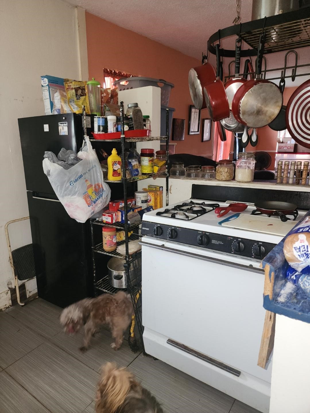 332 Pennsylvania Street Houston, TX 77029 - Photo 12 of 22 a kitchen with a stove and a wooden floor