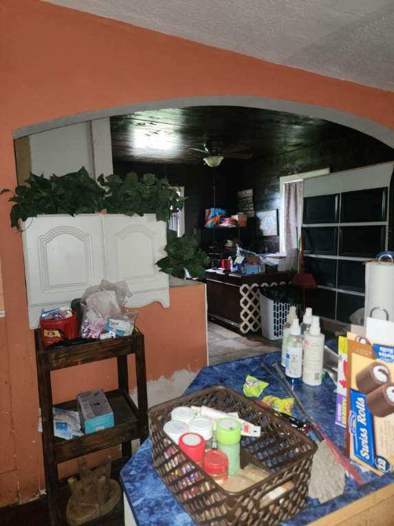 332 Pennsylvania Street Houston, TX 77029 - Photo 10 of 22 a room with lot of furniture and a wooden floor