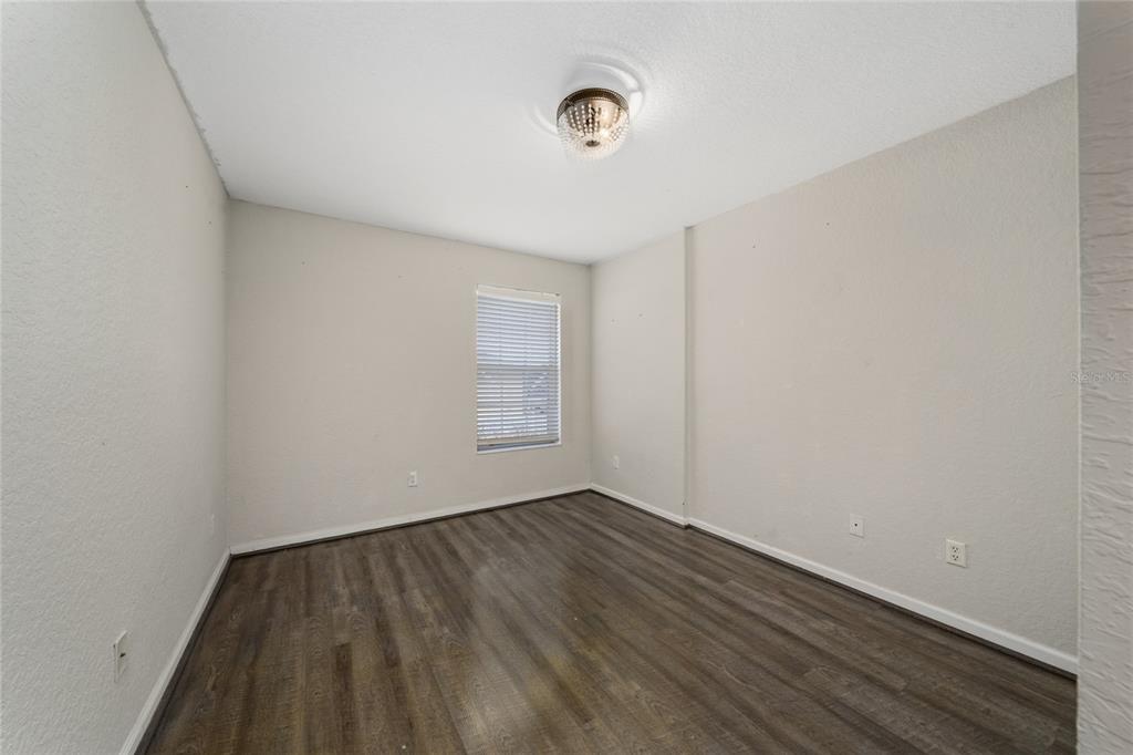 2962 White Cedar Circle Kissimmee, FL 34741 - Photo 13 of 24 a view of room with window and hardwood floor
