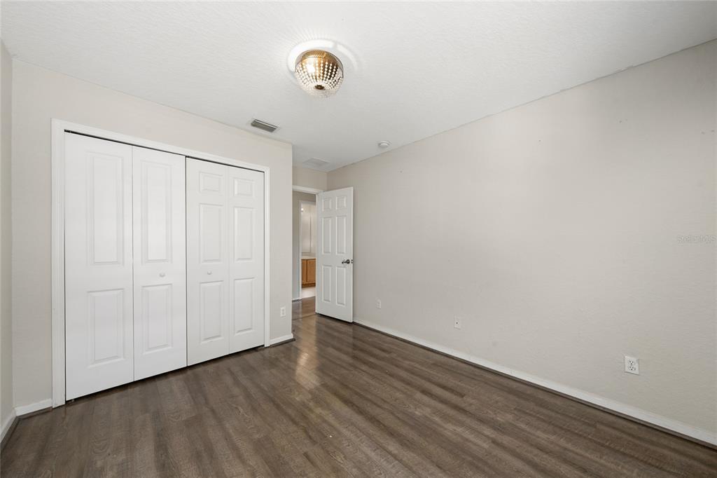 2962 White Cedar Circle Kissimmee, FL 34741 - Photo 14 of 24 a view of an empty room with wooden floor