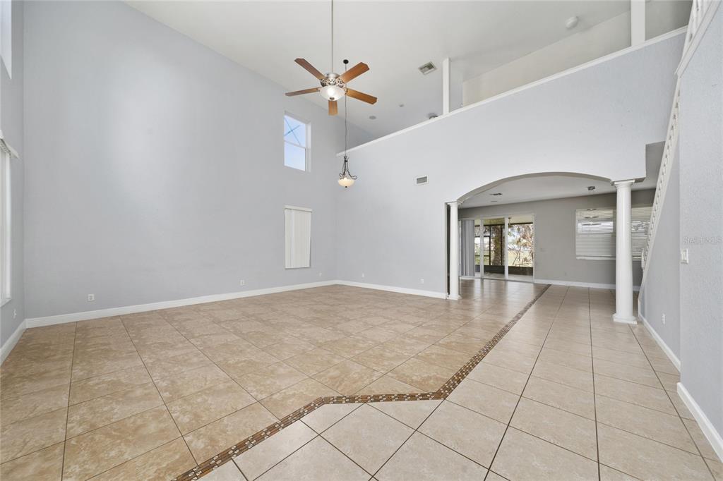 2962 White Cedar Circle Kissimmee, FL 34741 - Photo 3 of 24 a view of a hallway with a chandelier