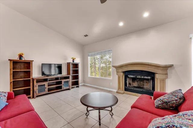 a livingroom with furniture and a fireplace