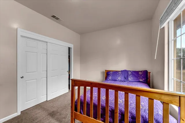 a view of a hallway with windows