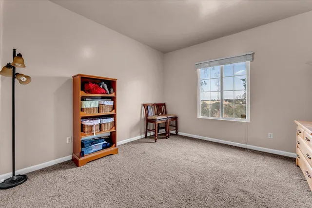 an empty room with furniture and a window