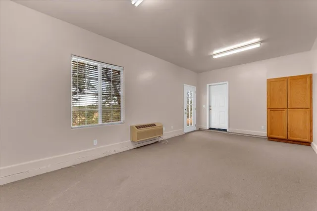 an empty room with windows