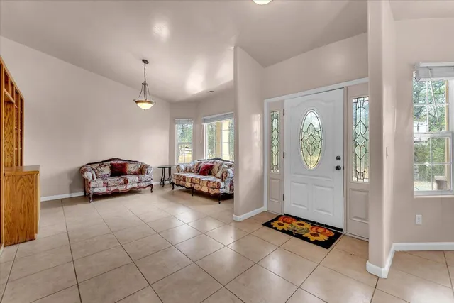 a living room with furniture and a table