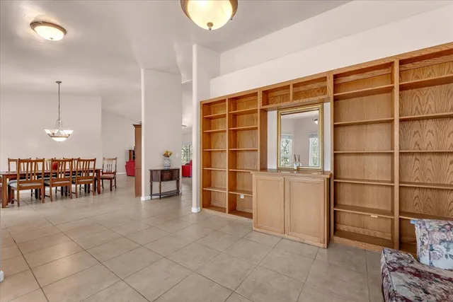 a view of a livingroom with furniture and staircase