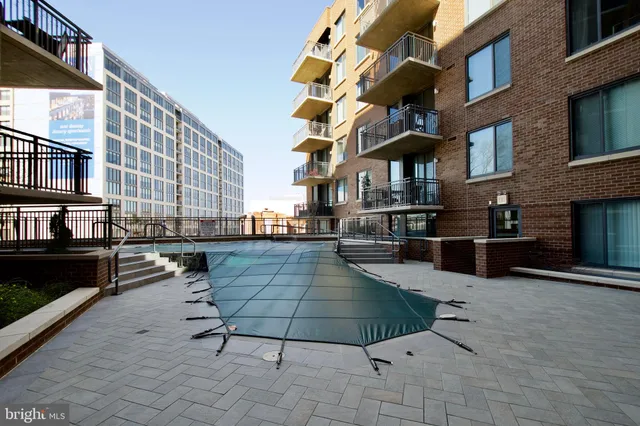 a view of a swimming pool with chairs