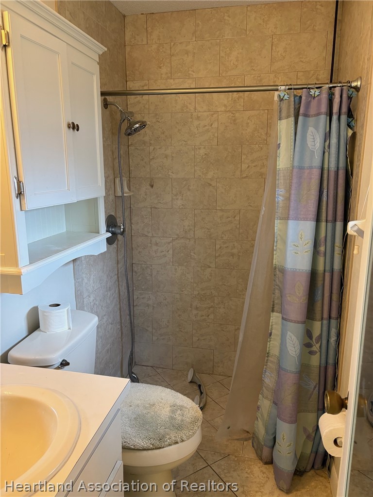3913 Ferrari Drive Sebring, FL 33872 - Photo 12 of 20 a bathroom with a sink and a shower
