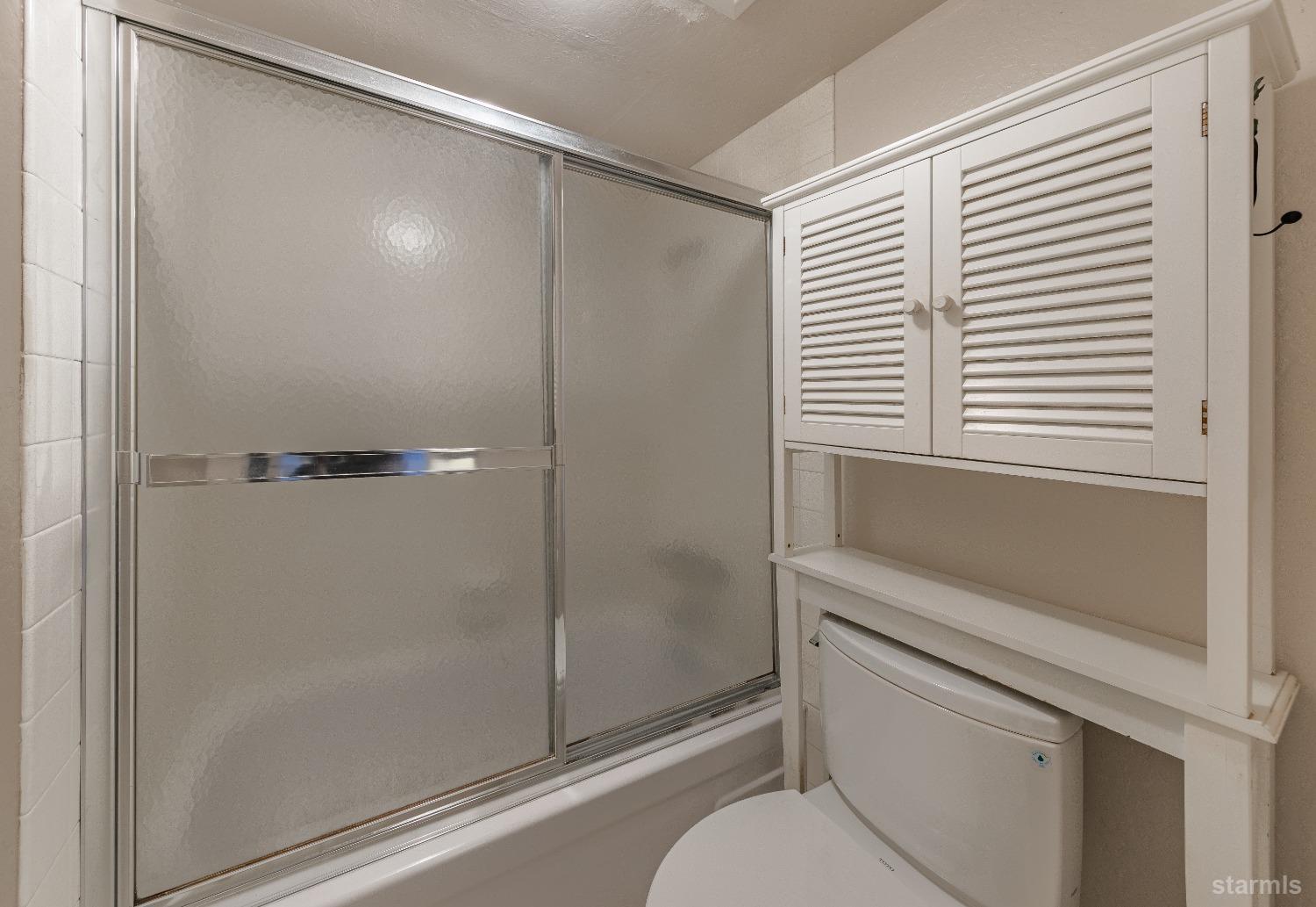 439 Ala Wai Boulevard, Unit 121 South Lake Tahoe, CA 96150 - Photo 11 of 35 a bathroom with a shower and a toilet