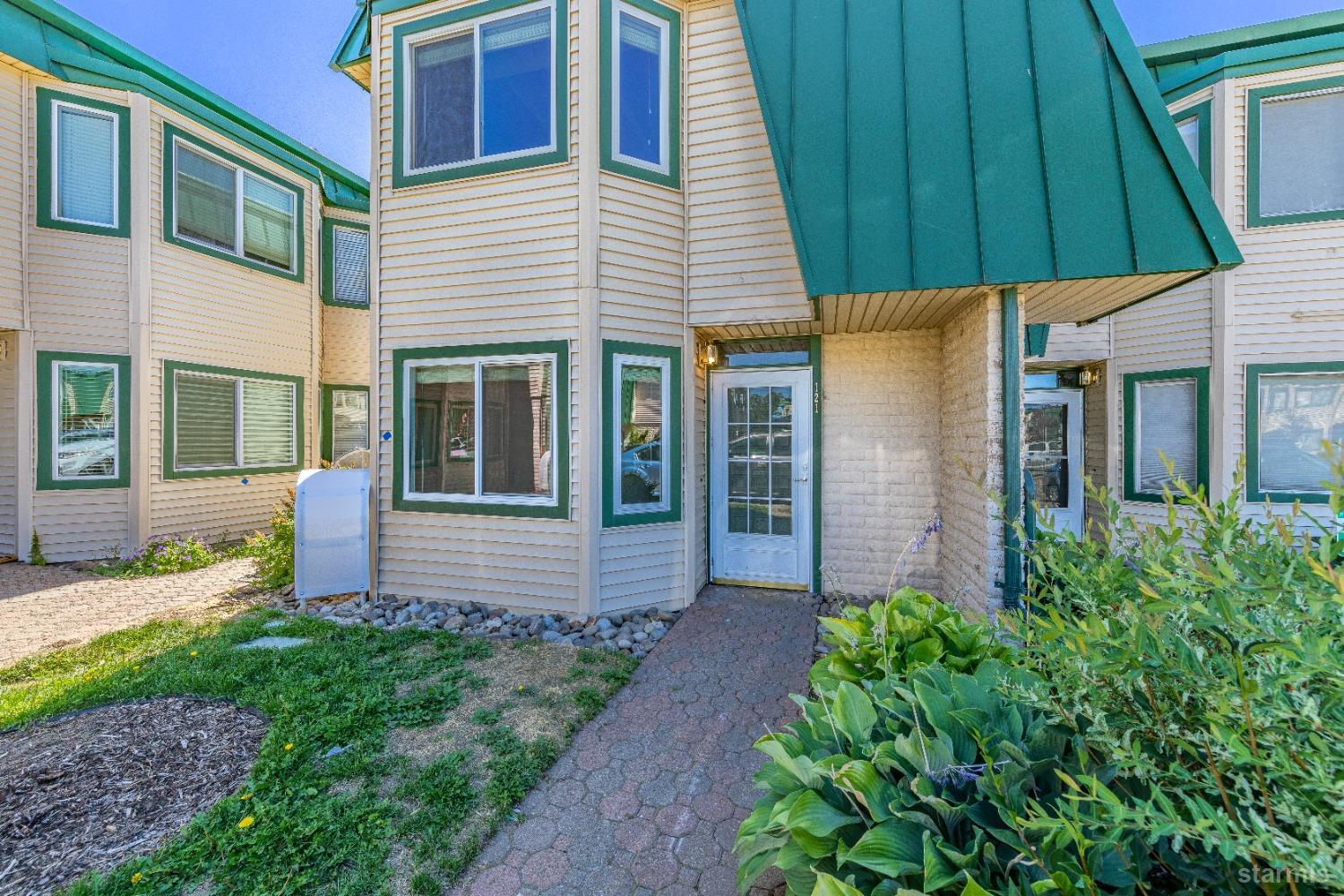 439 Ala Wai Boulevard, Unit 121 South Lake Tahoe, CA 96150 - Photo 24 of 35 a front view of a house with garden