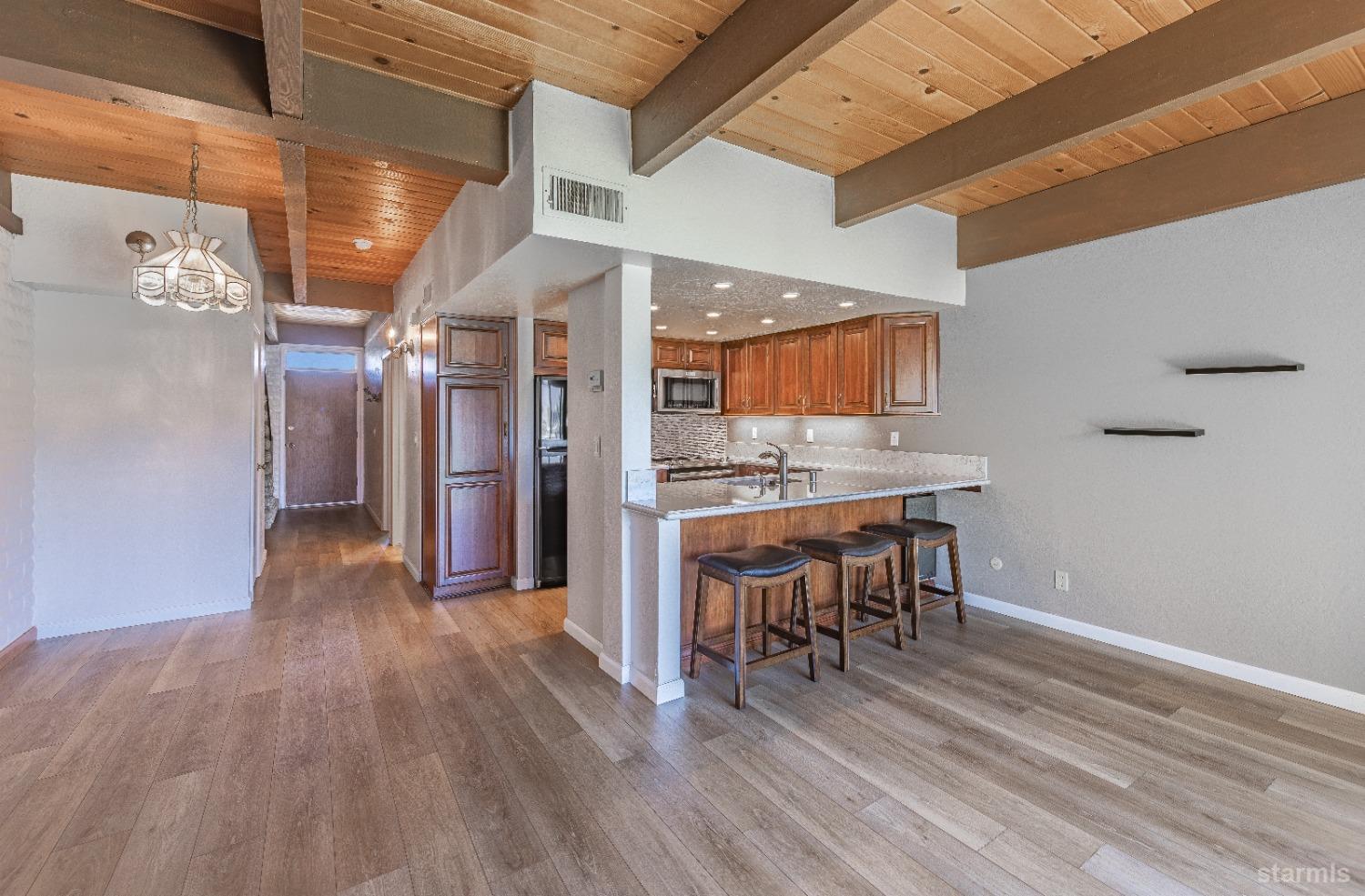 439 Ala Wai Boulevard, Unit 121 South Lake Tahoe, CA 96150 - Photo 5 of 35 a view of a kitchen and dining room