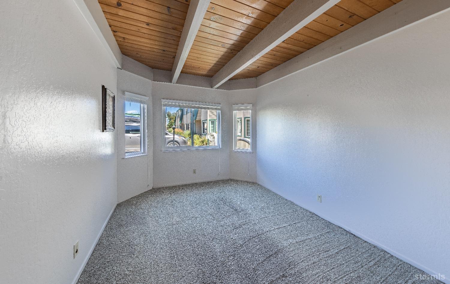 439 Ala Wai Boulevard, Unit 121 South Lake Tahoe, CA 96150 - Photo 9 of 35 an empty room with windows