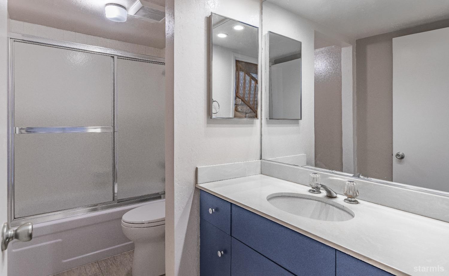 439 Ala Wai Boulevard, Unit 121 South Lake Tahoe, CA 96150 - Photo 10 of 35 a bathroom with a sink a toilet and shower