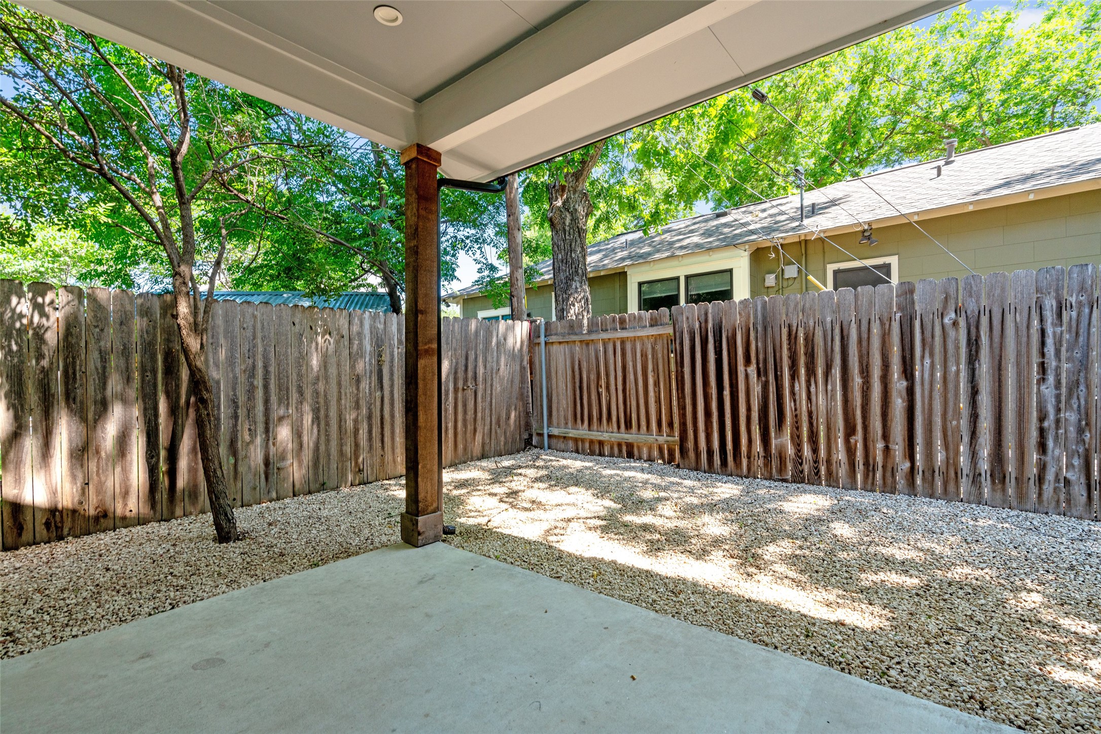 5200 Grover Avenue Austin, TX 78756 - Photo 28 of 32 Outdoor patio space featuring a concrete slab, zero landscaping and fully fenced for privacy.
