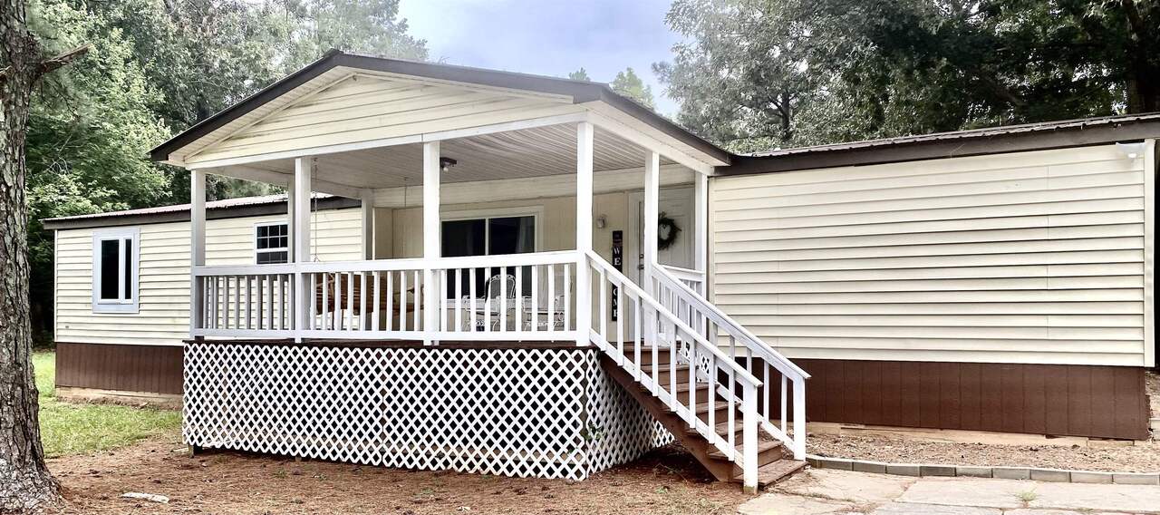 3786 Holly Springs Road Pendergrass, GA 30567 - Photo 1 of 1 a view of a house with a deck