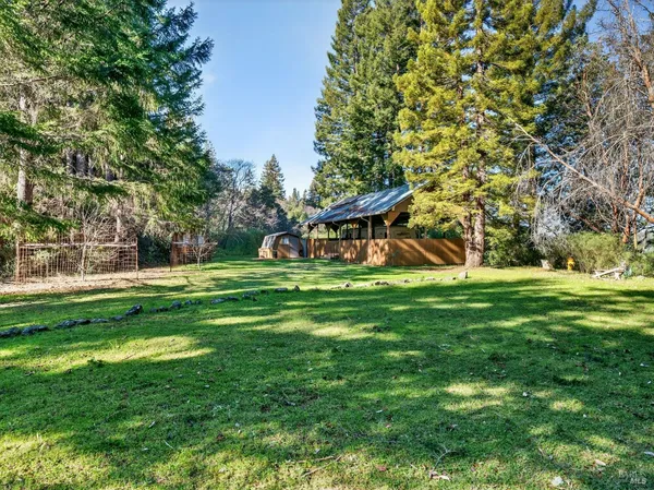 a view of a house with a big yard