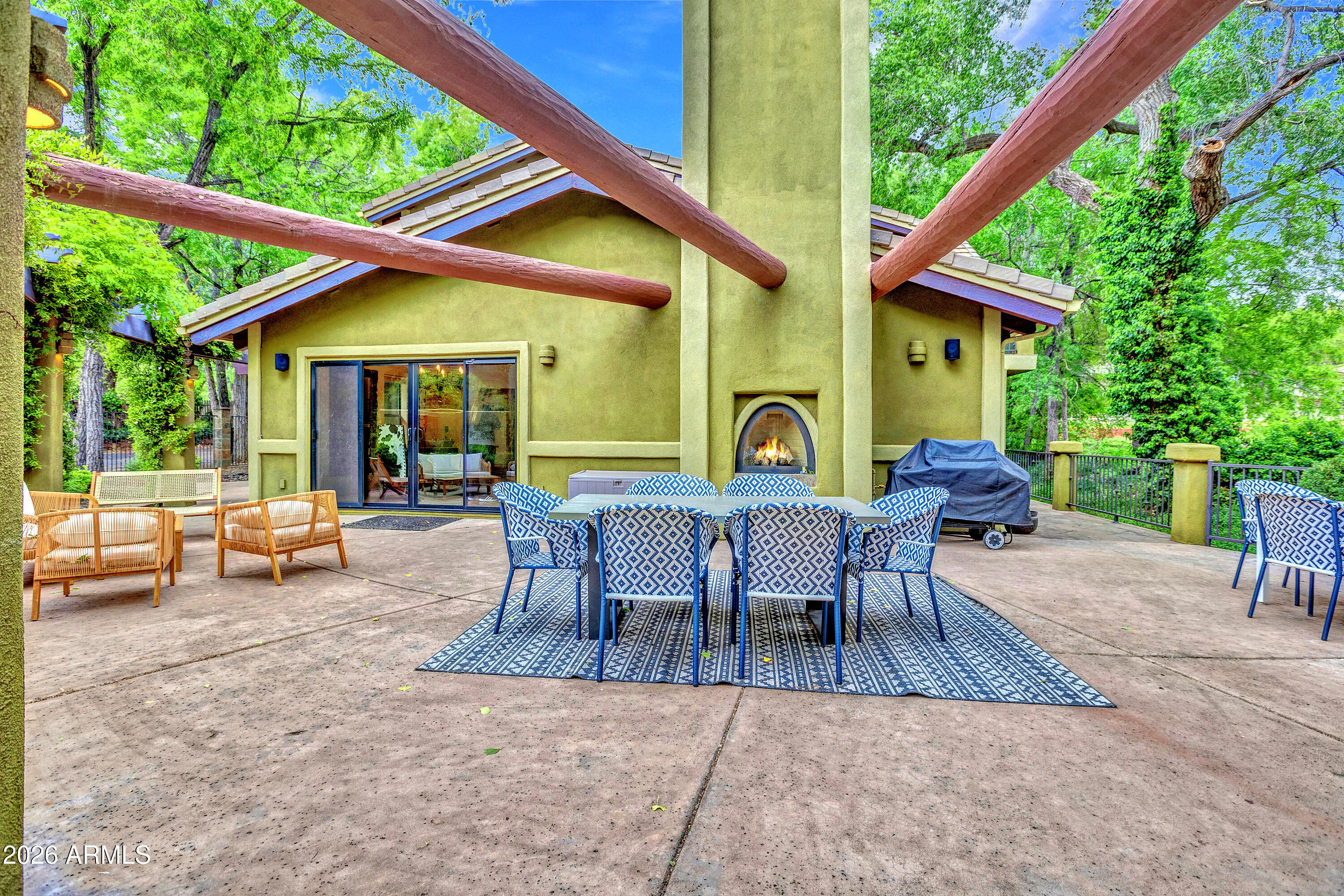 55 Ranch House Circle Sedona, AZ 86336 - Photo 56 of 61 a view of a patio with a table and chairs under an umbrella