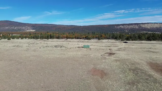 a view of ocean beach and mountain