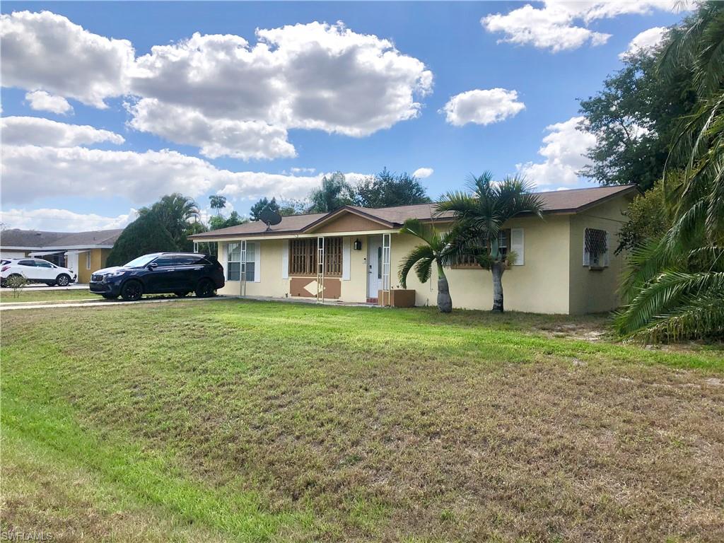 19 Massachusetts Road Lehigh Acres, FL 33936 - Photo 3 of 20 a view of a house with backyard