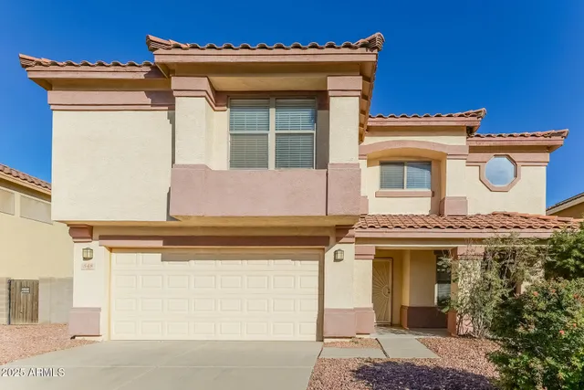 a view of a white house with a large windows
