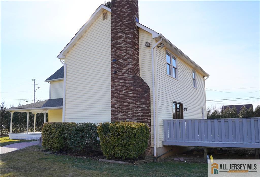 226 Gravel Hill Road Monroe Township, NJ 08831 - Photo 3 of 9 a view of a house with a backyard