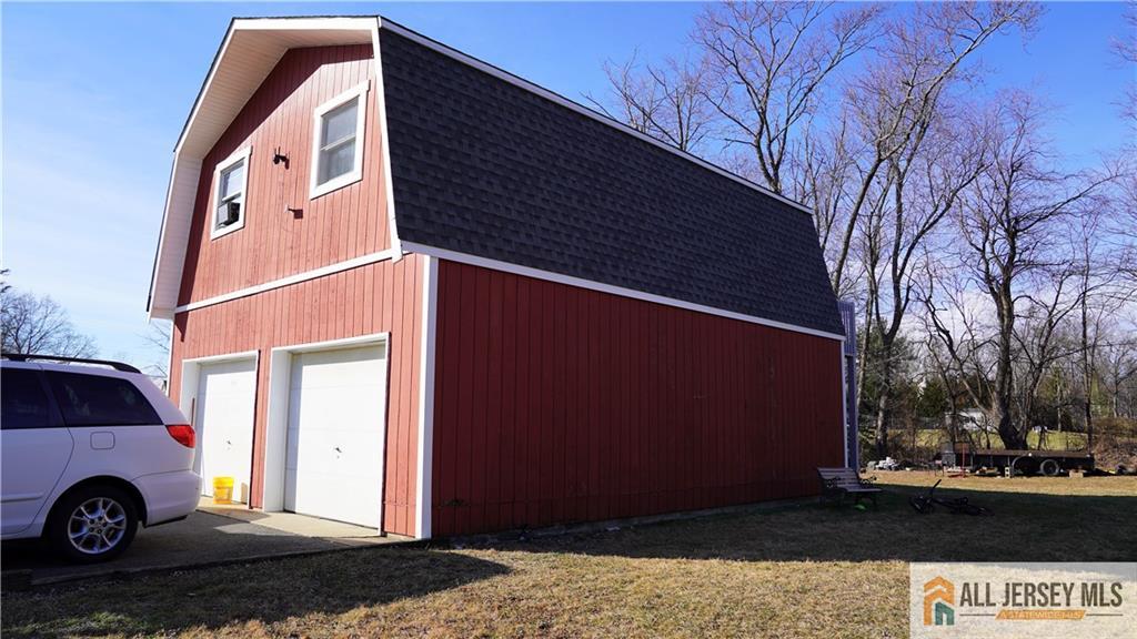 226 Gravel Hill Road Monroe Township, NJ 08831 - Photo 4 of 9 a view of a street with a car parked in front of it