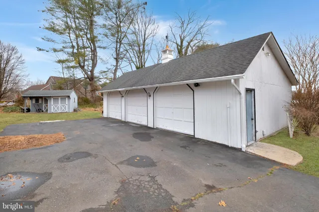a view of house with outdoor space and a garage