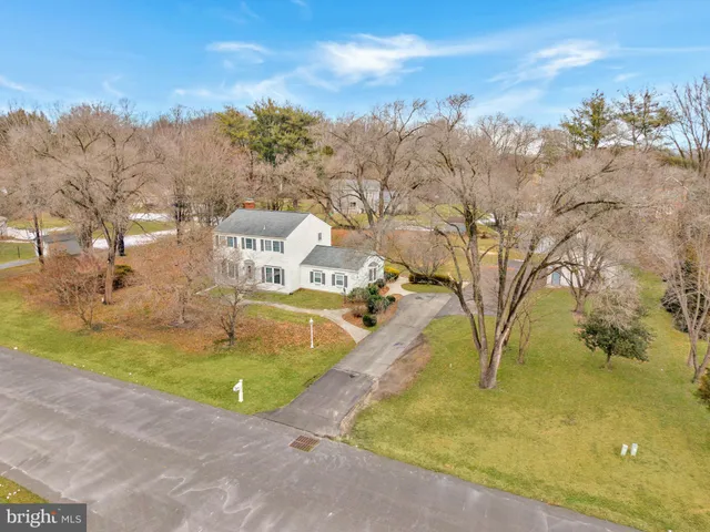 a view of a swimming pool with an outdoor space and seating area