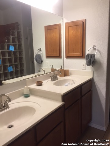 25914 Mission Bluff Boerne, TX 78015 - Photo 13 of 16 a bathroom with a sink and a mirror