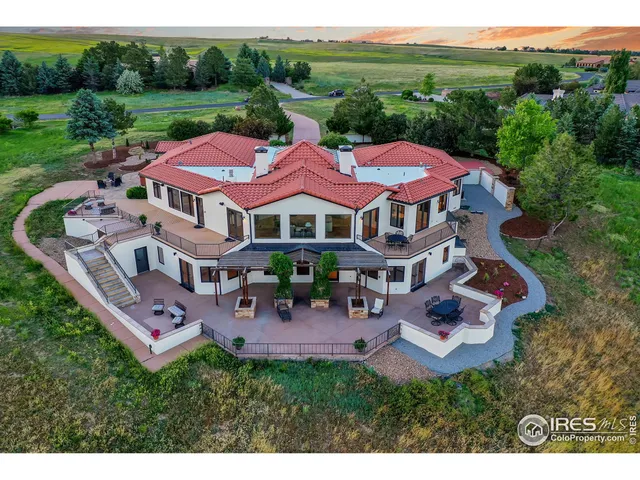 a view of a house with pool and a yard