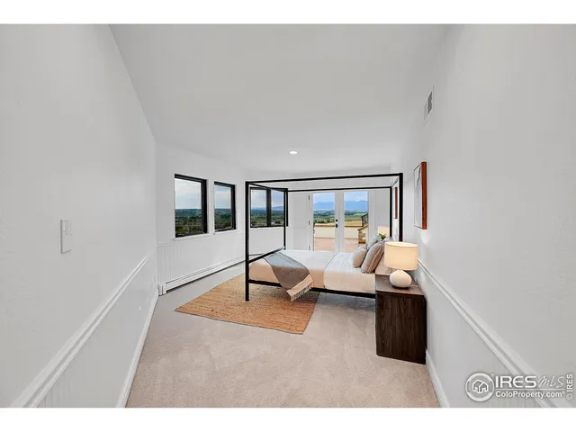 a view of a patio with dining table and chairs with wooden floor