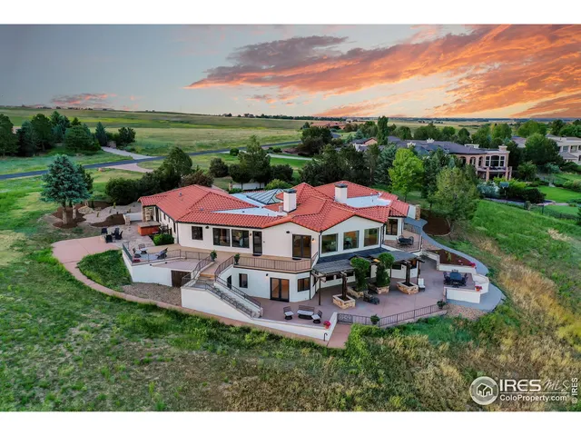 a view of a house with a yard and balcony