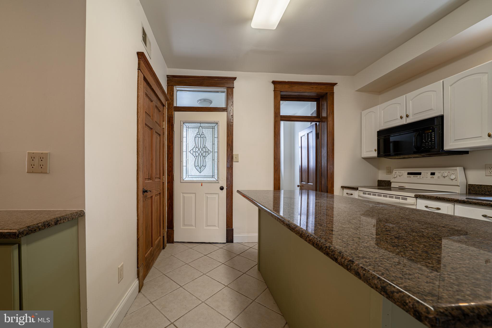 501 Warren Street Cumberland, MD 21502 - Photo 29 of 72 Kitchen Facing a Room that leads to the Backyard