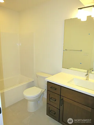 a bathroom with a toilet a sink and bathtub