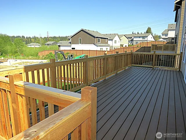 a view of a balcony with wooden floor