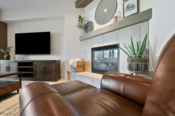 a kitchen with stainless steel appliances kitchen island granite countertop a sink dishwasher stove and cabinets