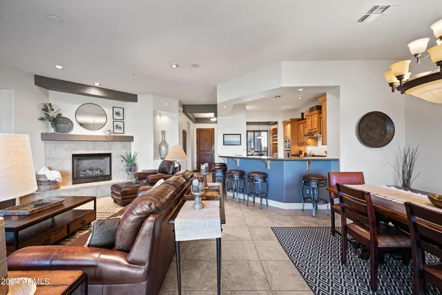 a view of a hallway with paintings on the wall