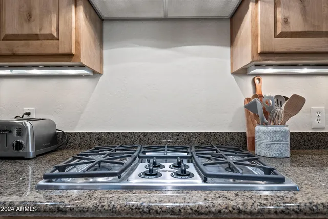 a living room with furniture and a lamp
