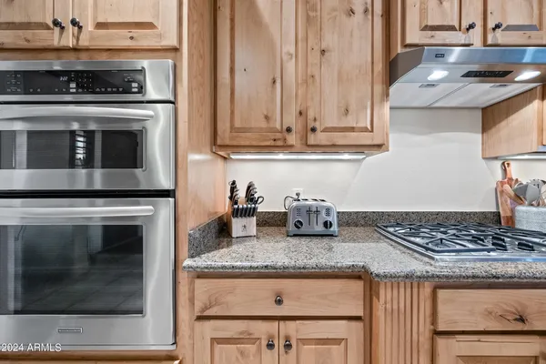 a living room with furniture a window and a flat screen tv